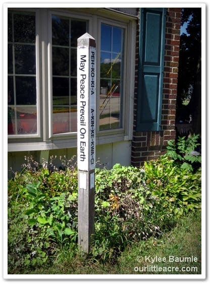 Peace pole in front of the meeting house at Manchester University, North Manchester, Indiana.